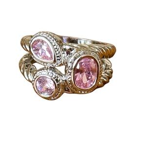 Brand new, silver/pink coloured ring, size 7.